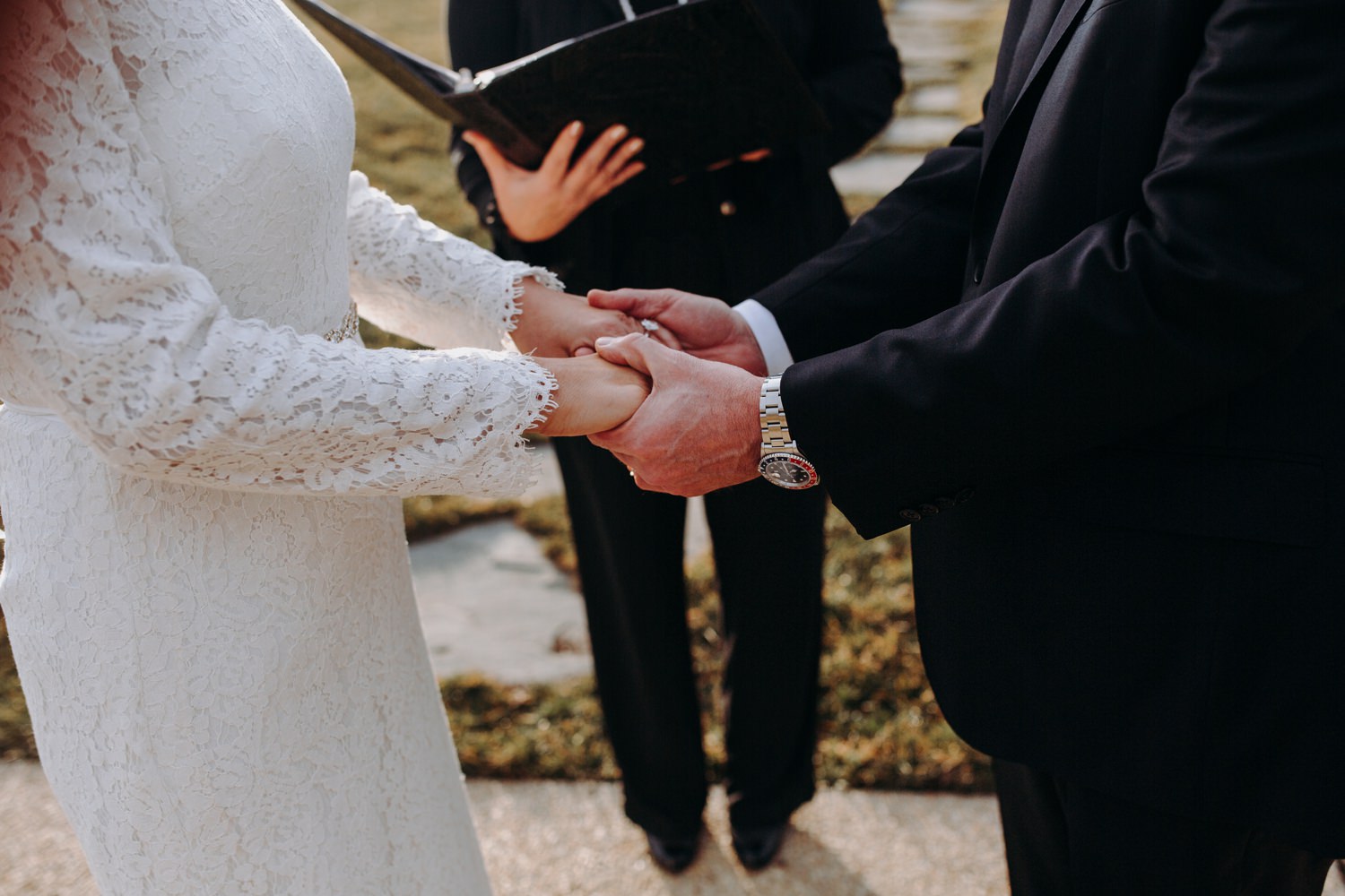 holding hands during ceremony