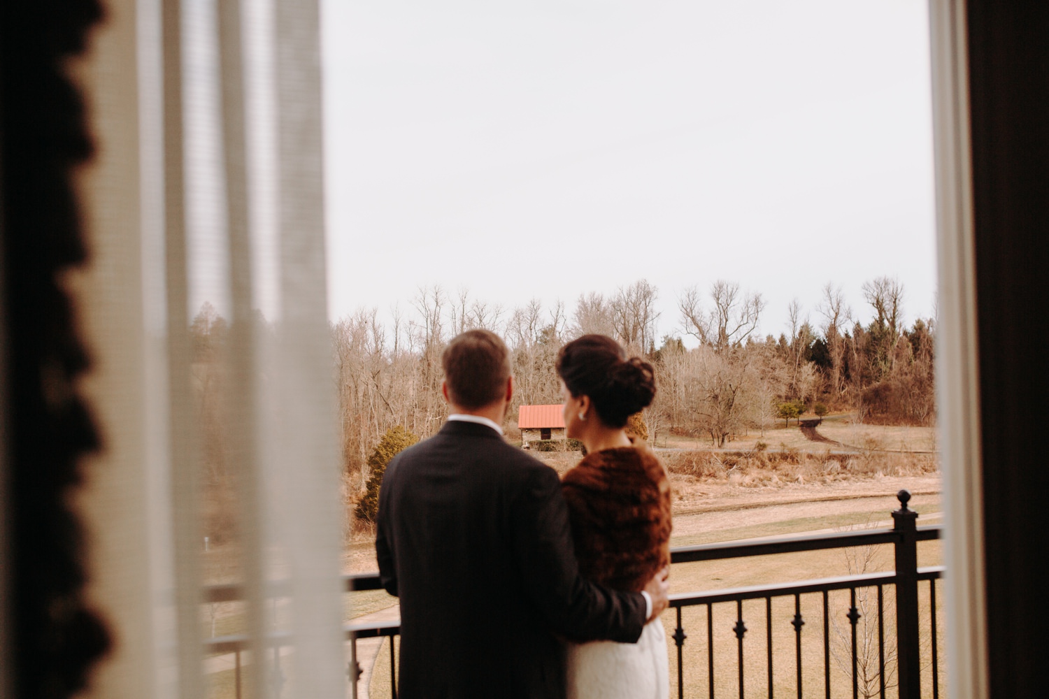 bride and groom on balcony