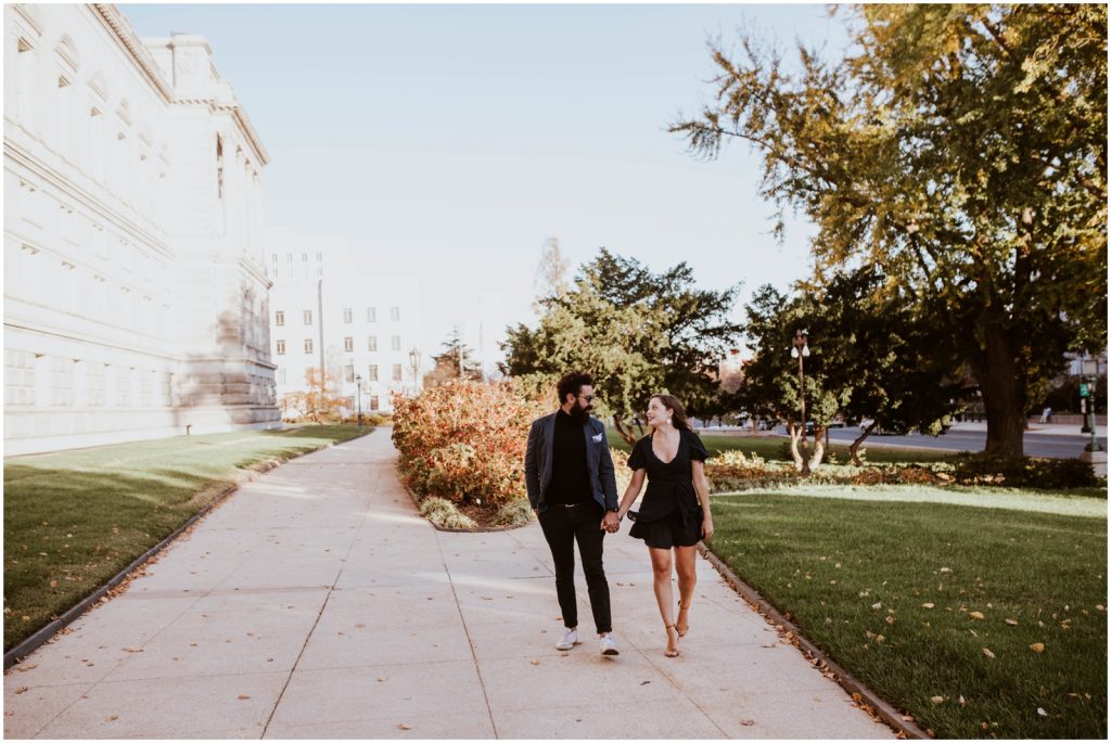 bride and groom walk through DC during Capitol Hill engagement session