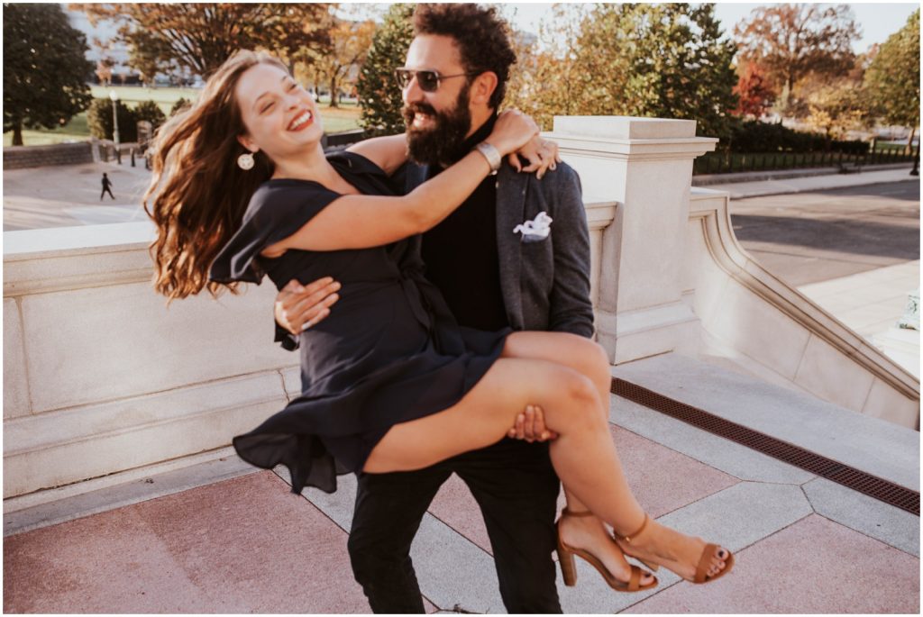 groom twirls bride around during DC engagement session