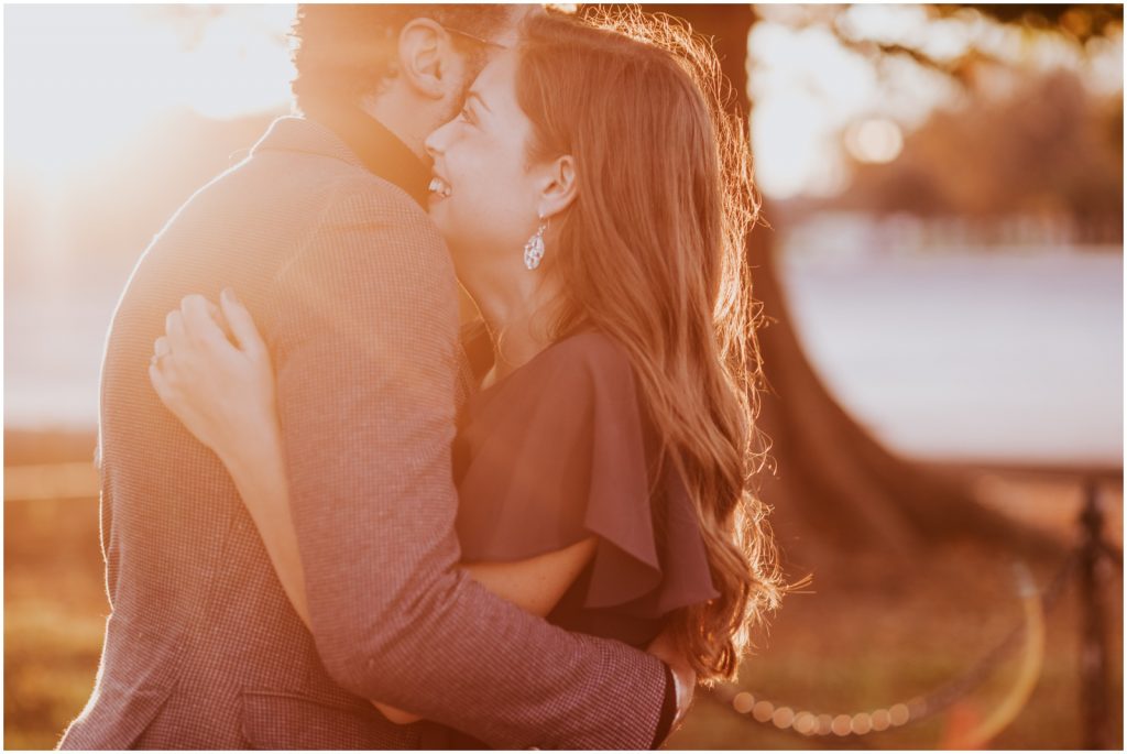 sunset Capitol Hill engagement session with groom hugging bride