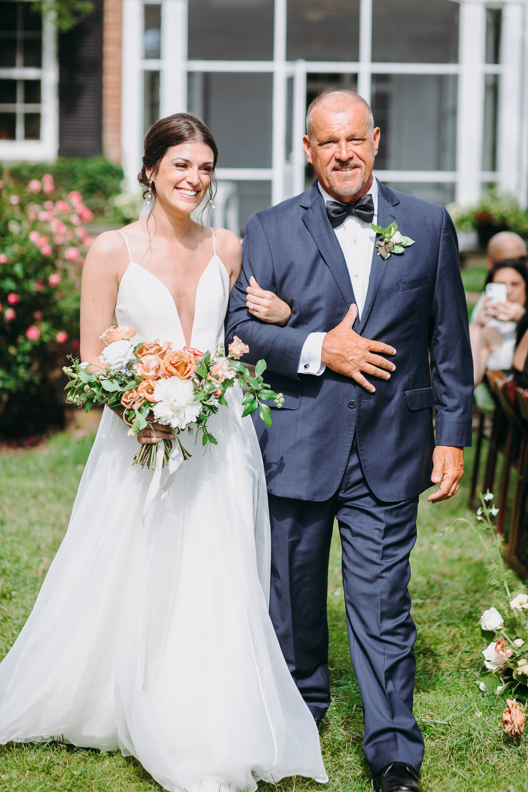 bride and dad walking at brittland ceremony