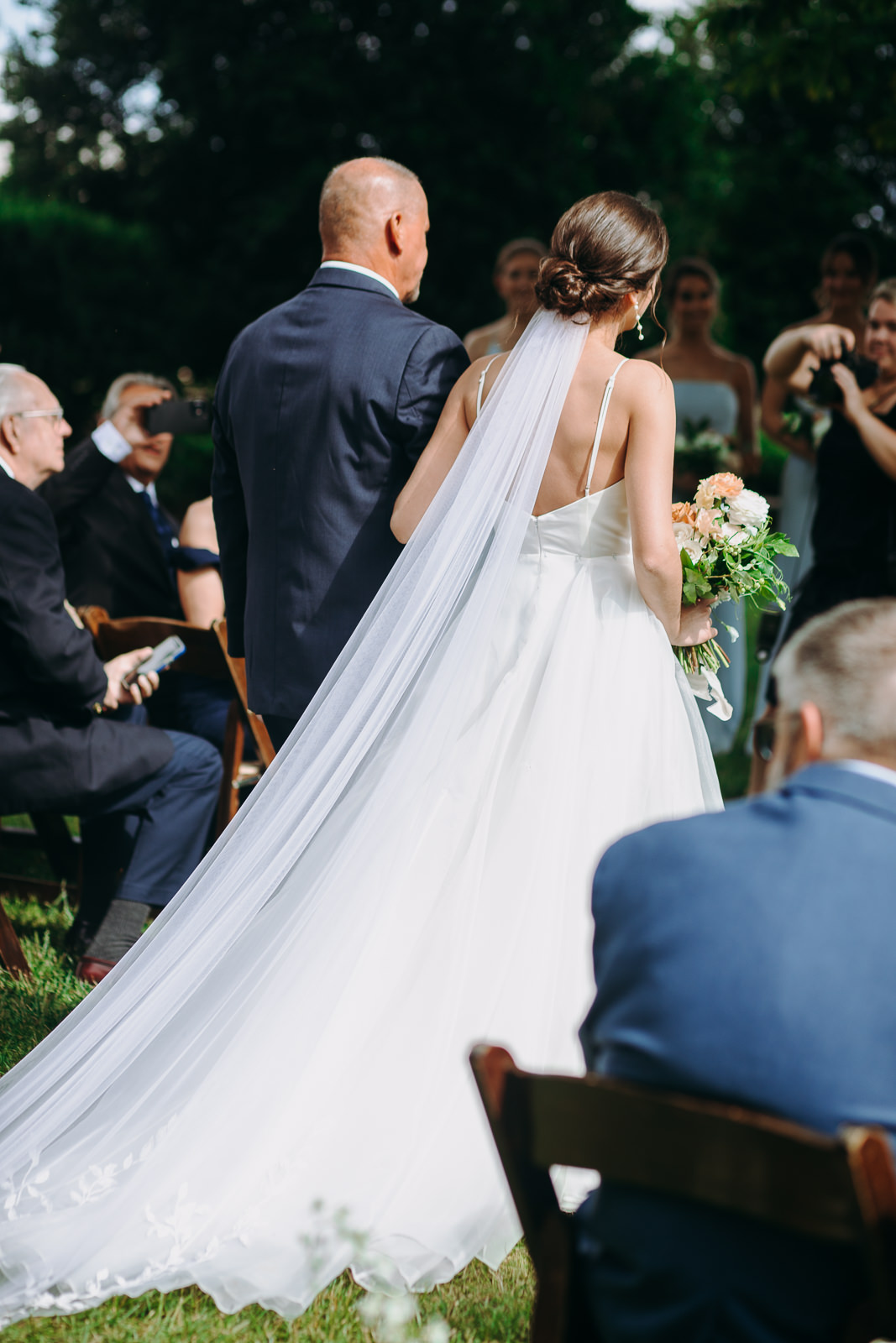 back of bride in aisle