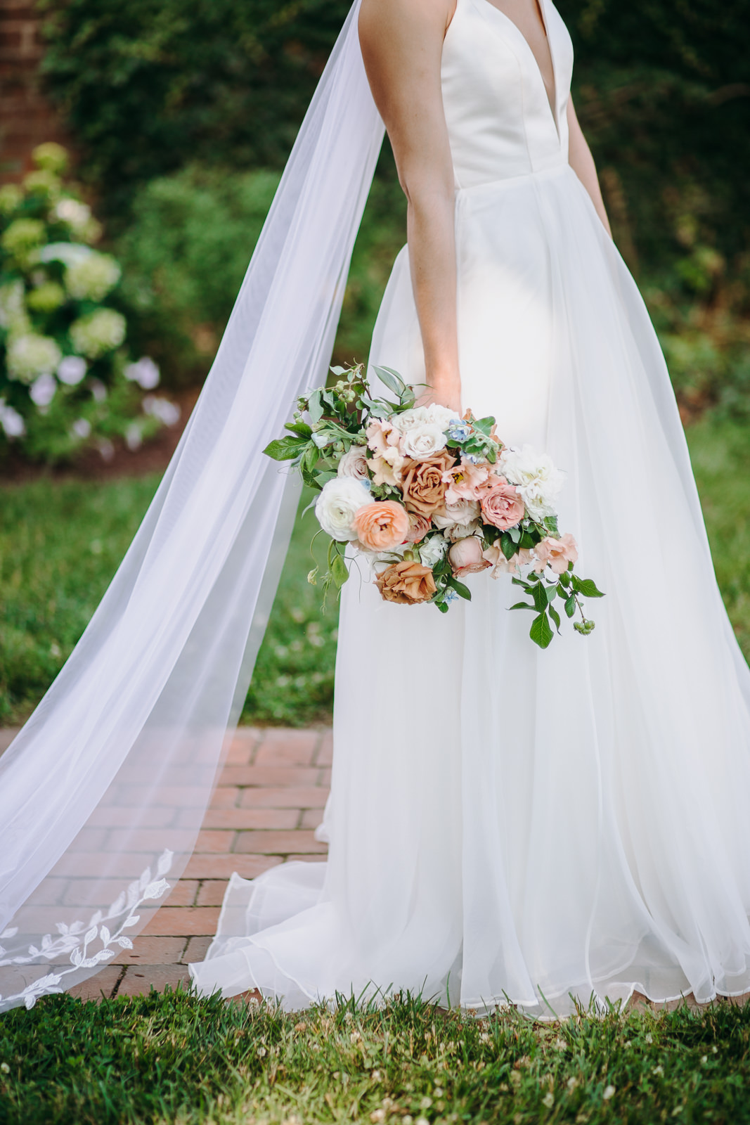 holding bouquet