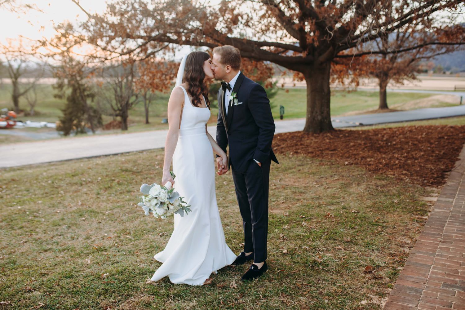 fall wedding portrait kiss