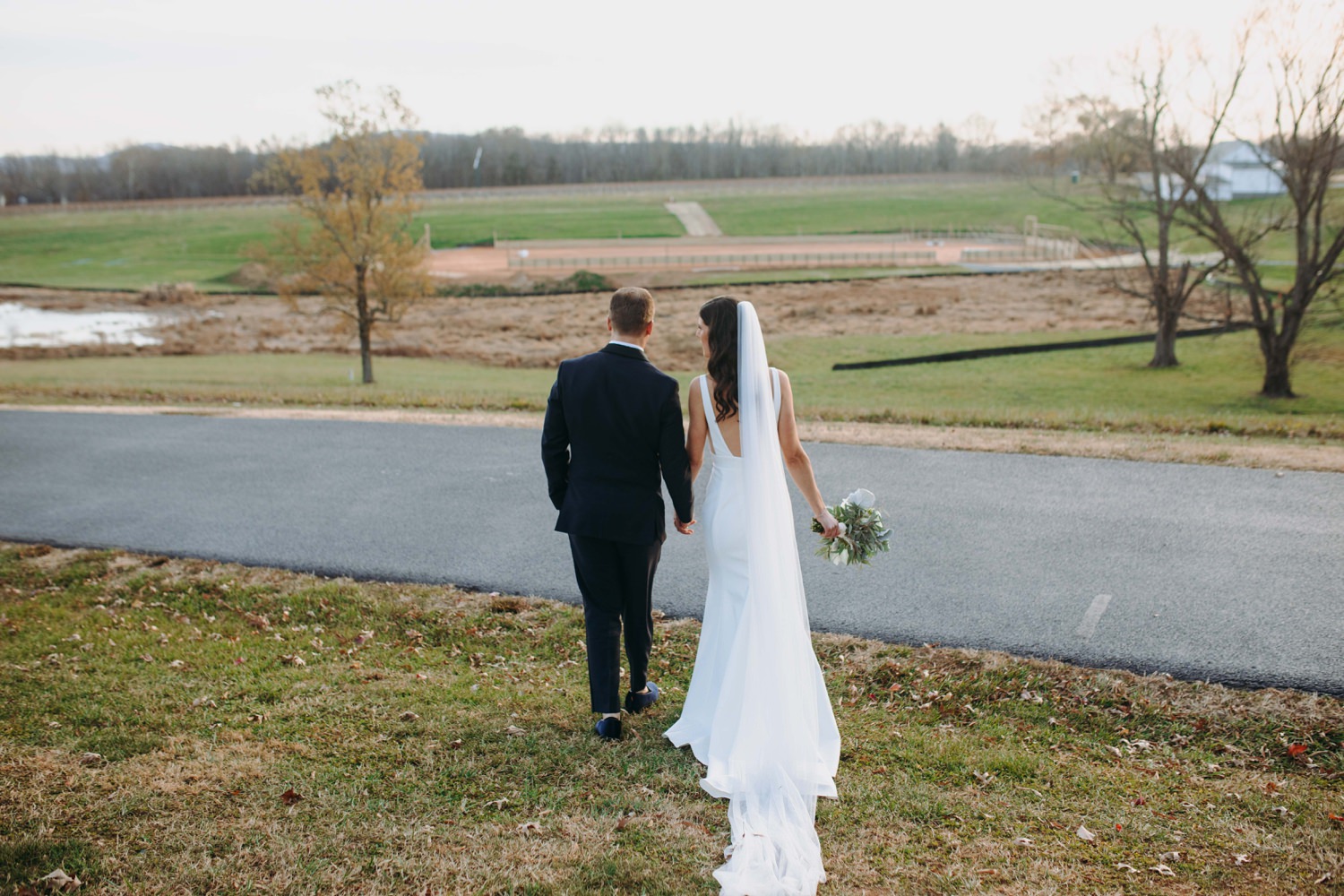 walking in sunset bride and groom