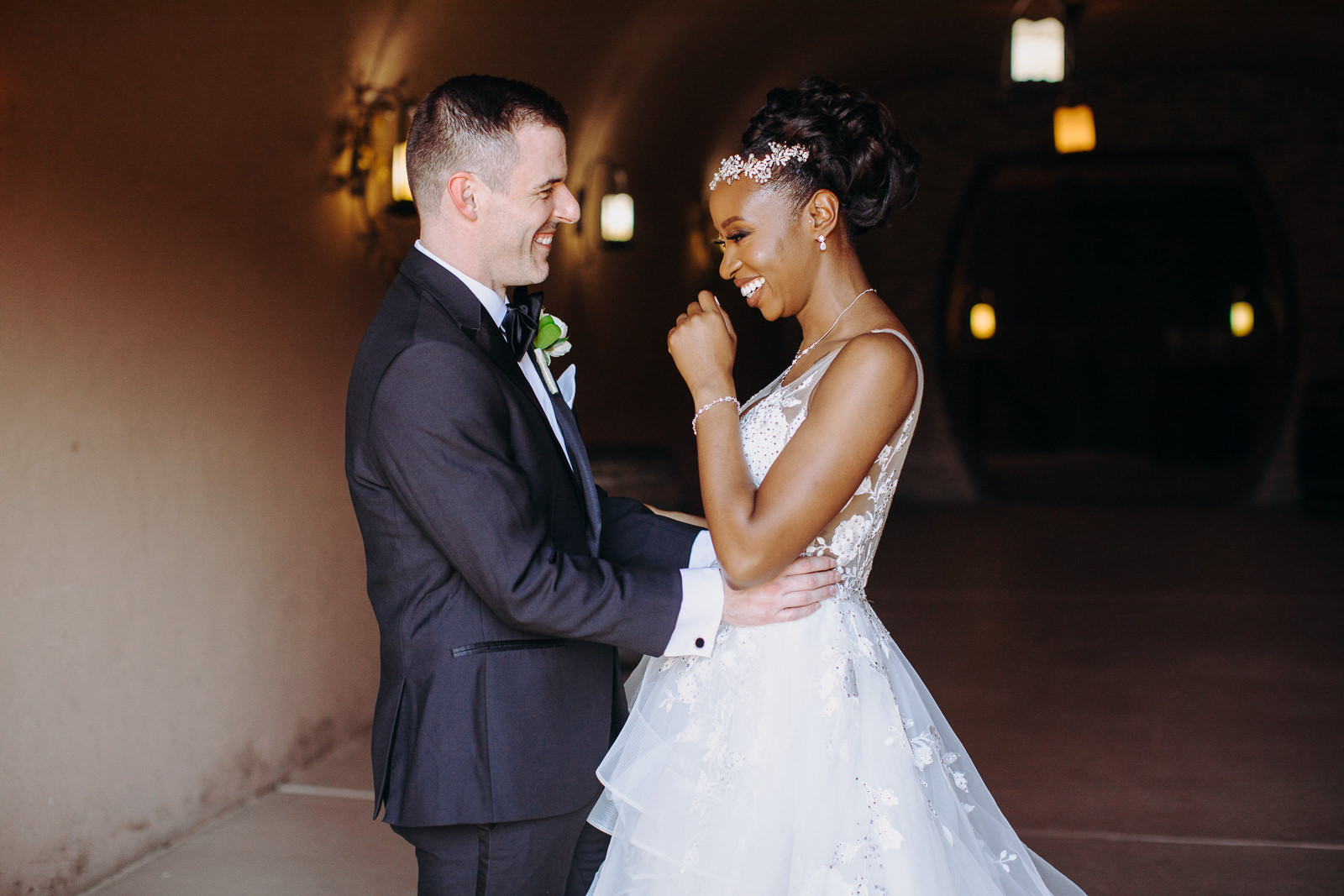 bride laughing in tunnel