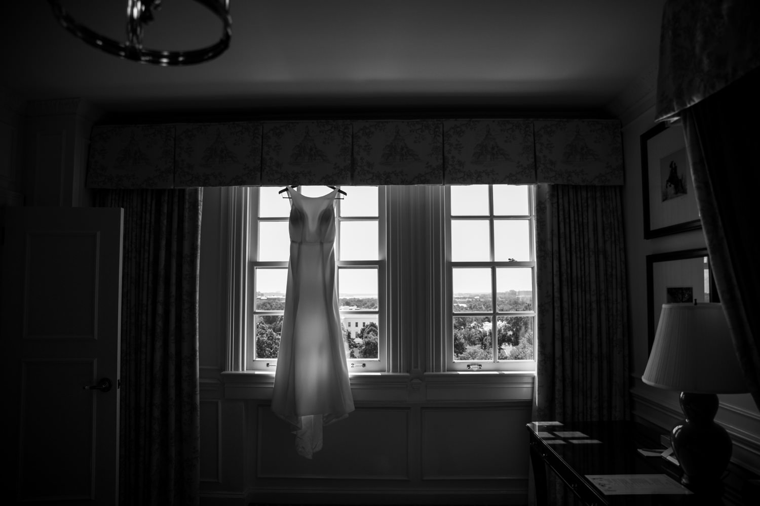 black and white wedding dress hanging