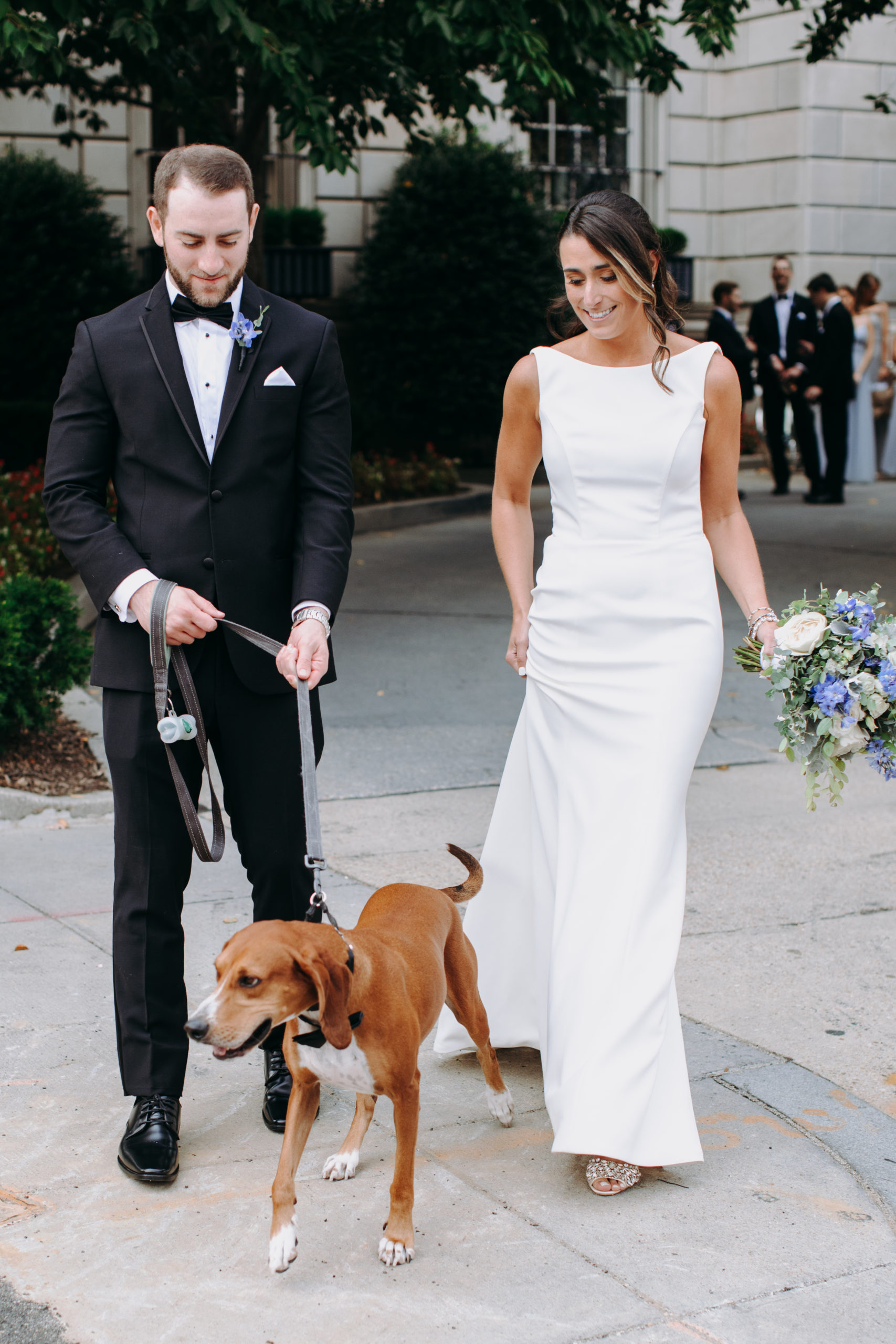 bride and groom with dog