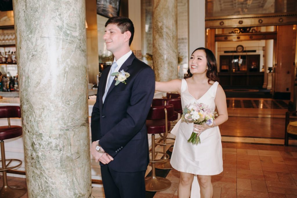 bride touching groom shoulder