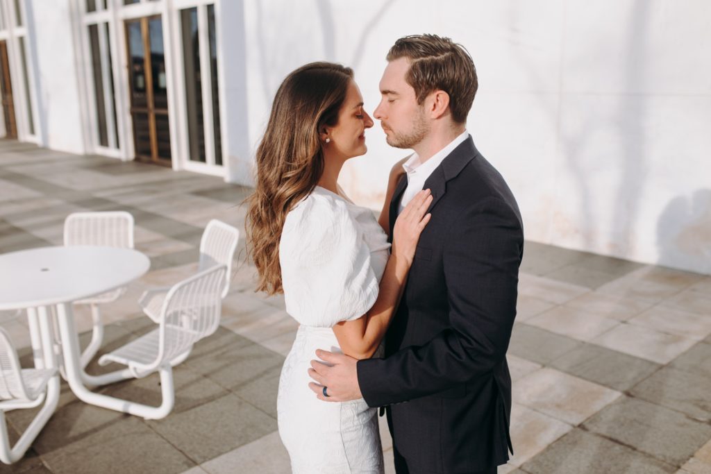 couple kissing on rooftop