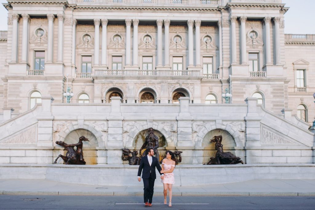 couple walking for their library of congress engagement photos