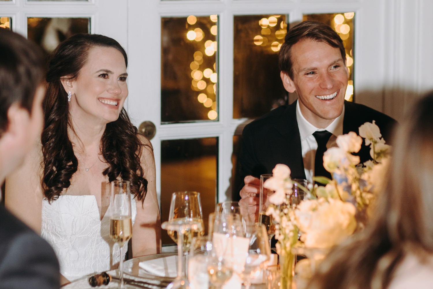 bride and groom react to speech at cocktail hour guests at fairmont dc wedding