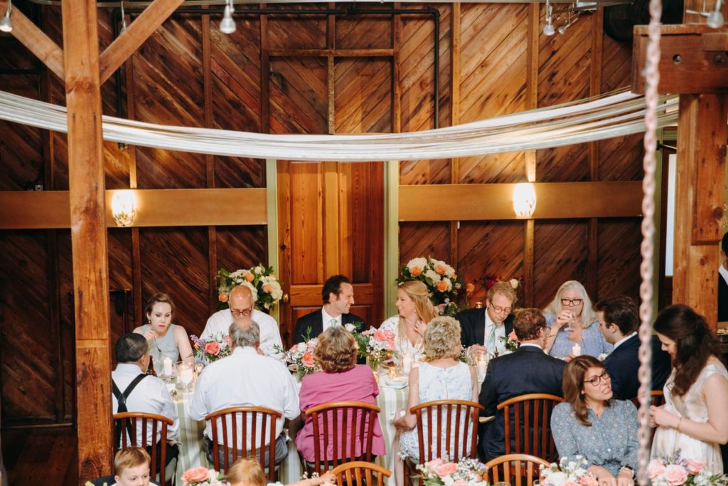 wedding reception at magnolias at the mill table eating