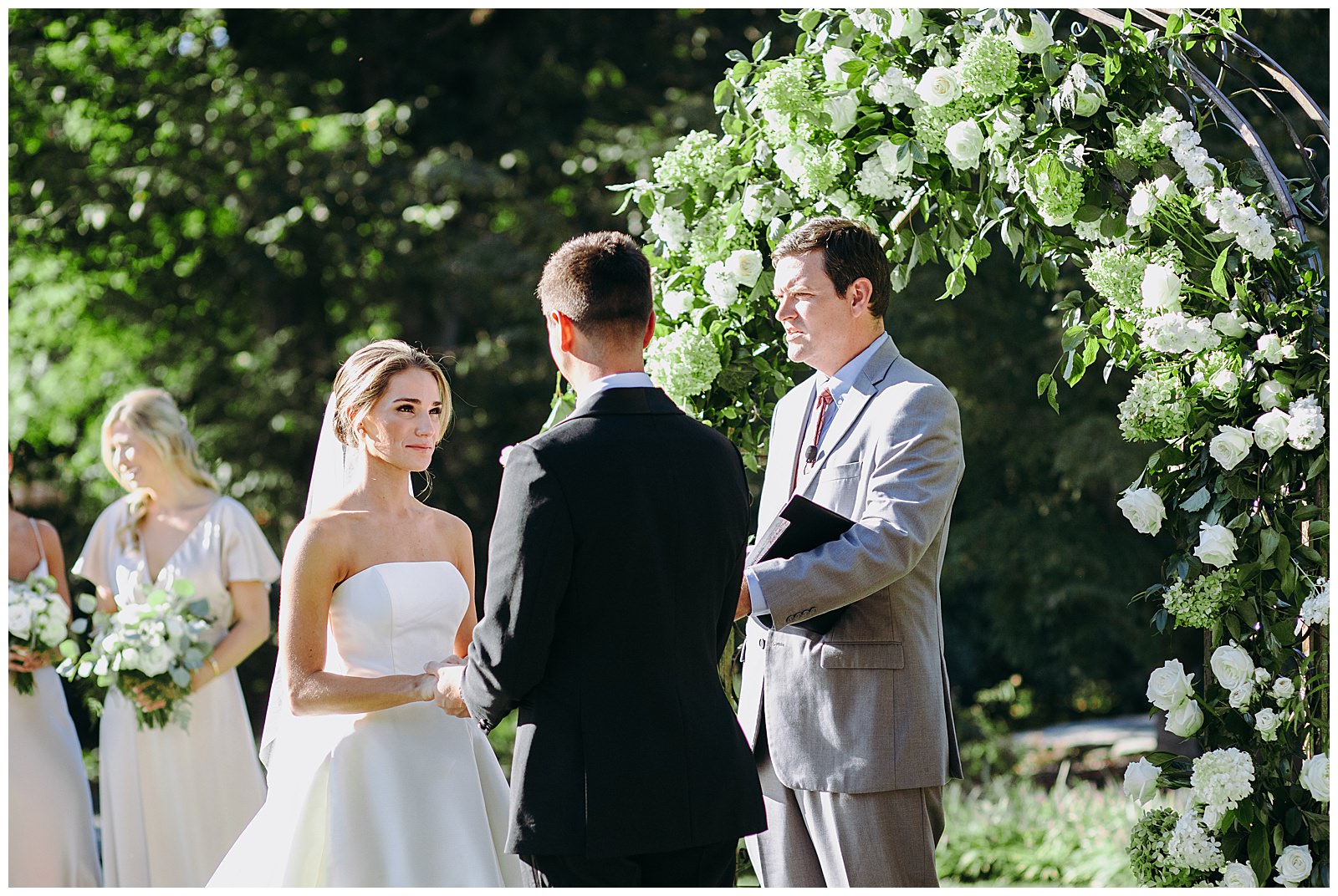 bride looks at groom during ceremony