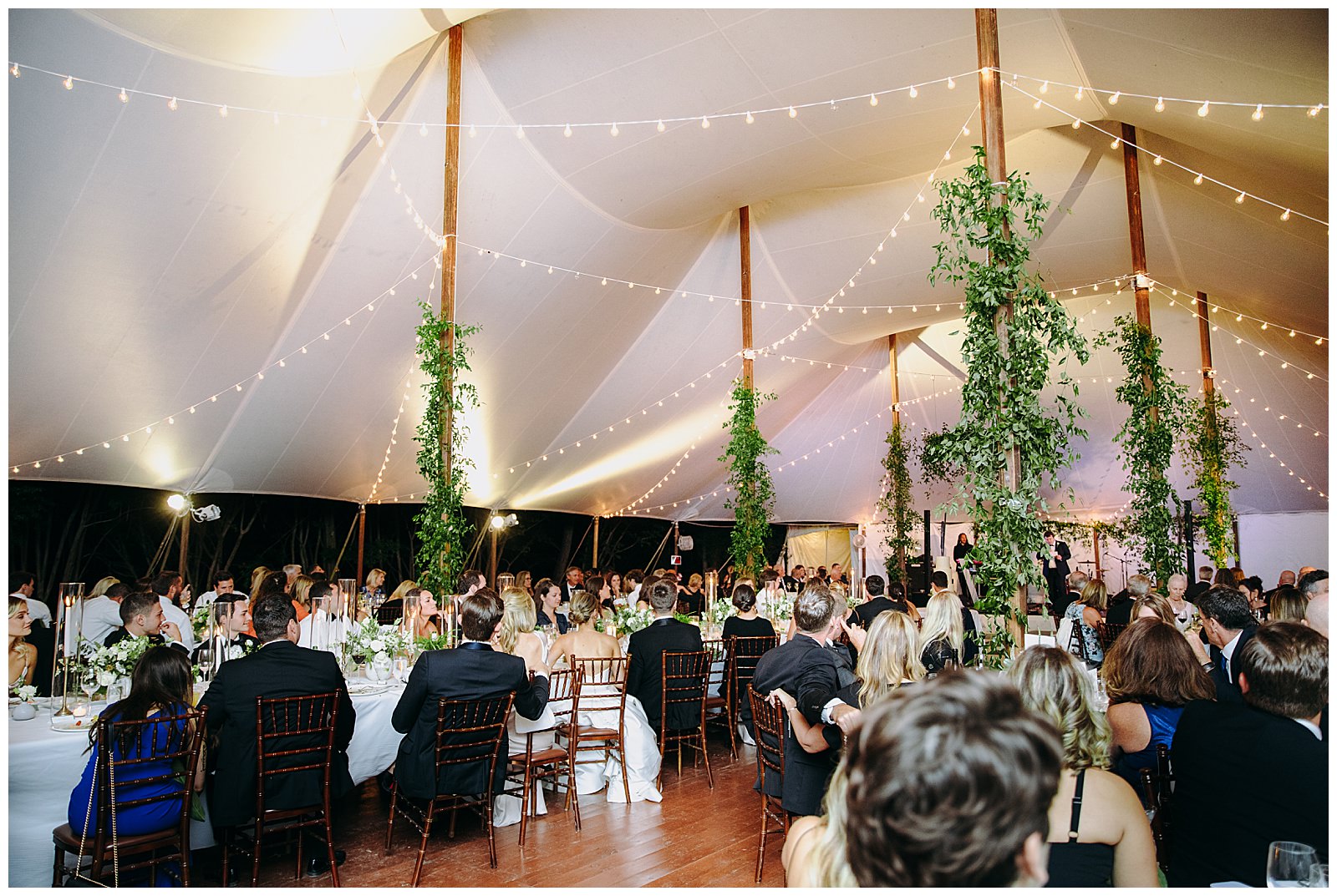 wedding guests at the Clifton Inn watch the dance floor for speeches