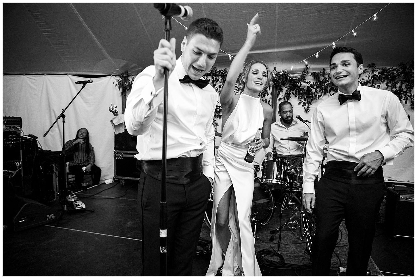 bride and friends dance on stage