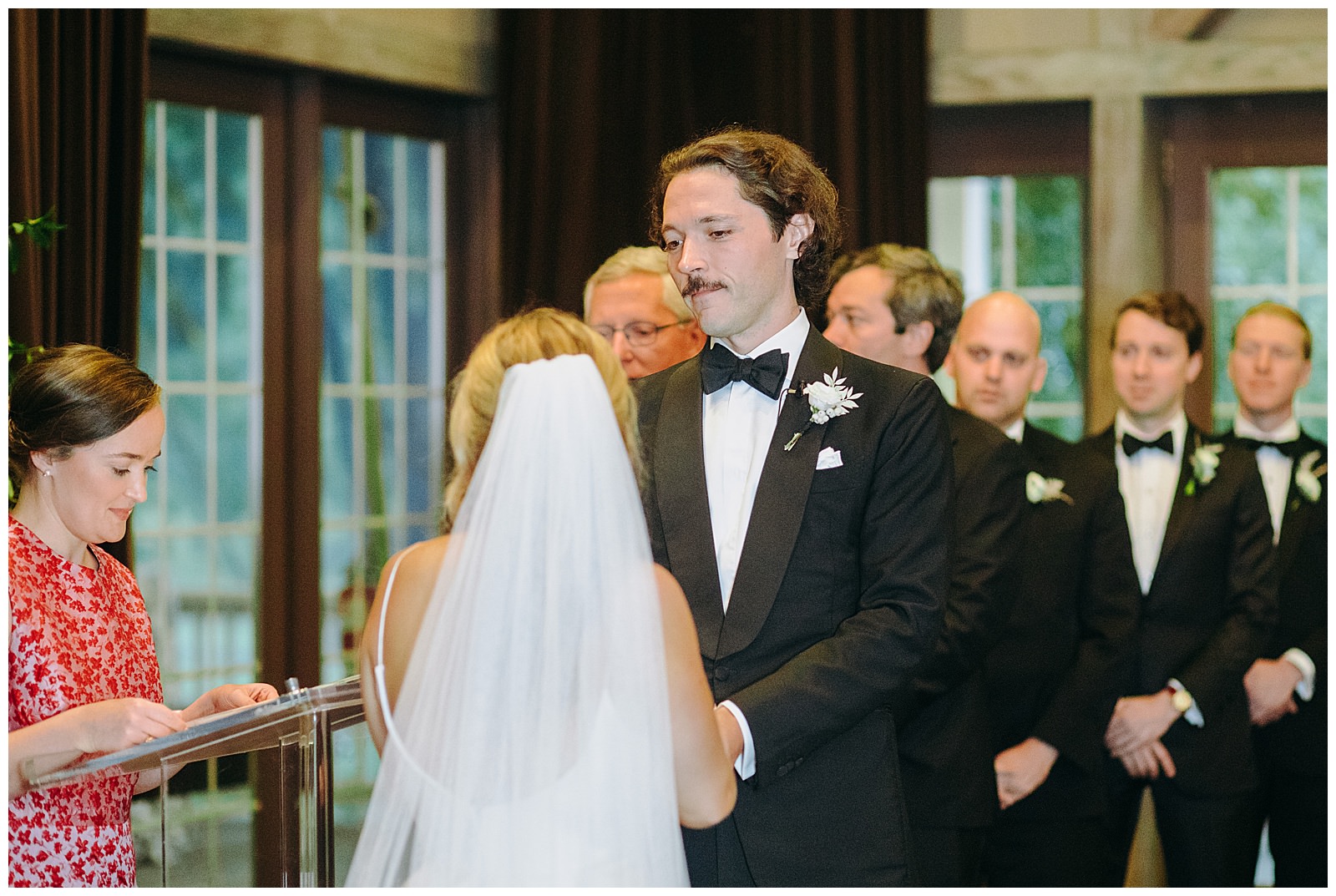 veritas wedding groom looks at bride
