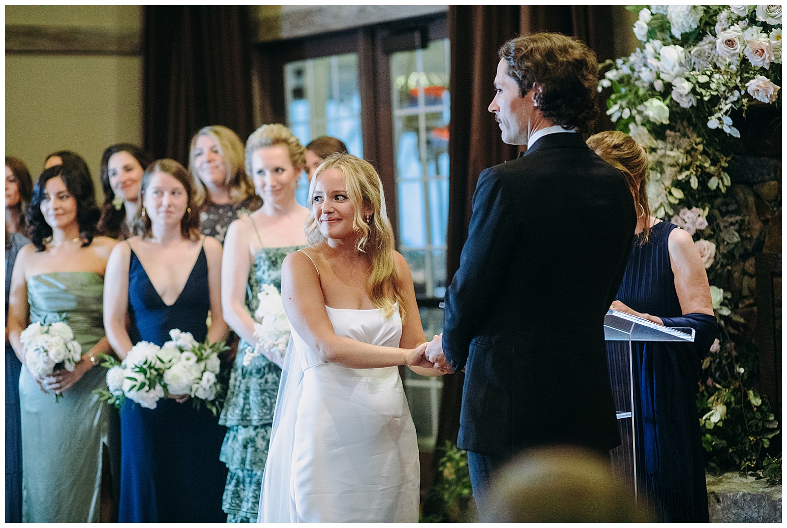 veritas wedding bride looks at guests during ceremony