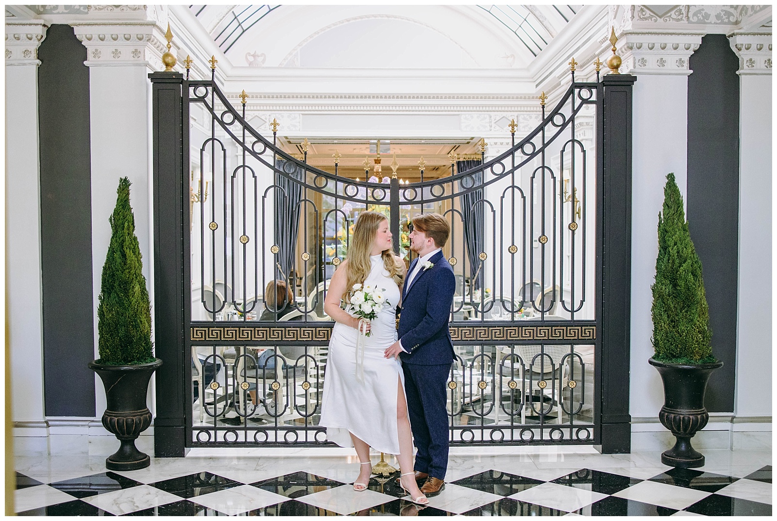 bride and groom in front of gate at their Washington DC Elopement