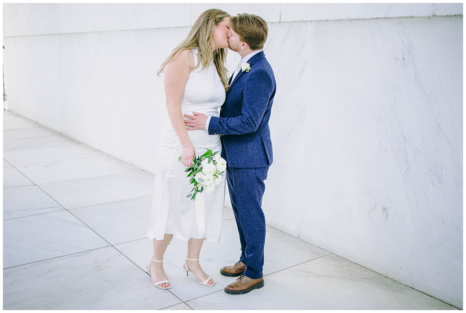 bride and groom kiss