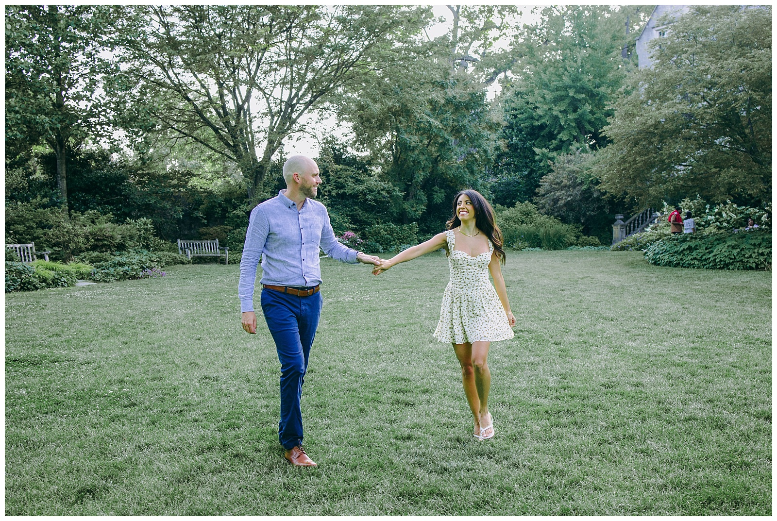 engaged couple holding hands