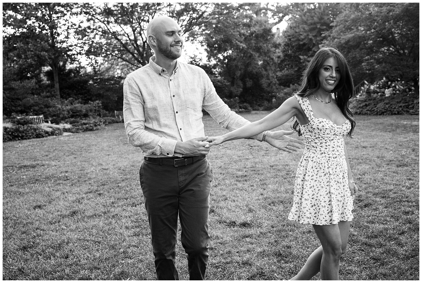 engaged couple holding hands