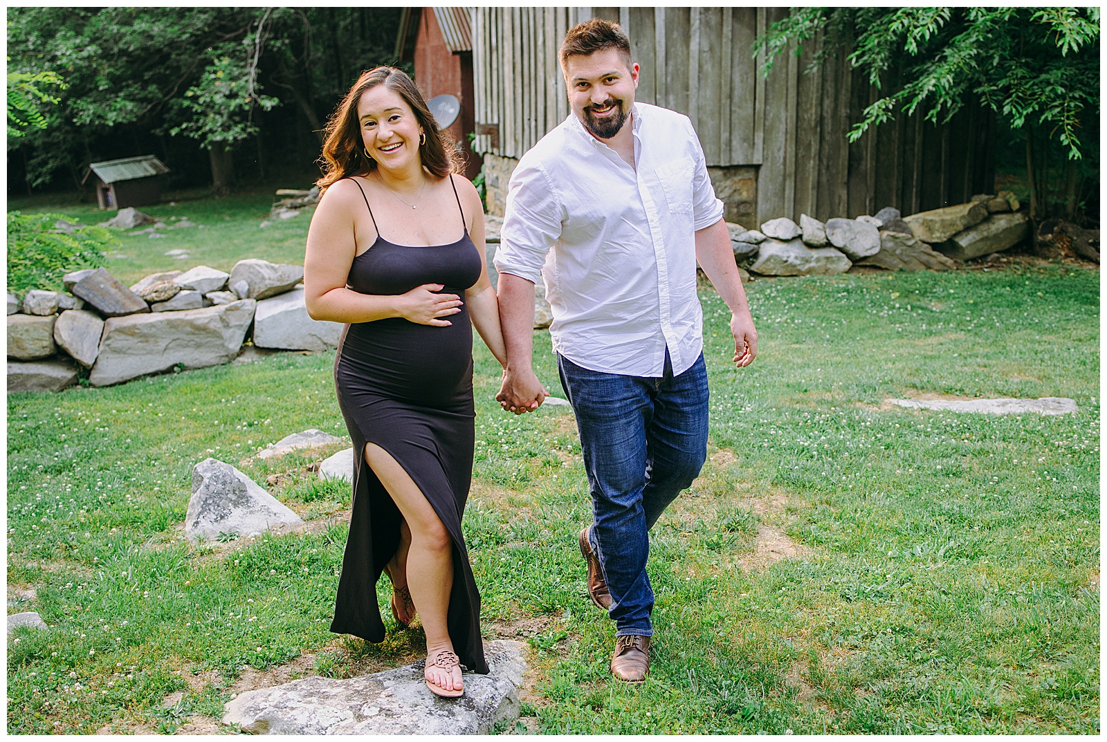 couple walking together, woman is pregnant, at their maternity photos
