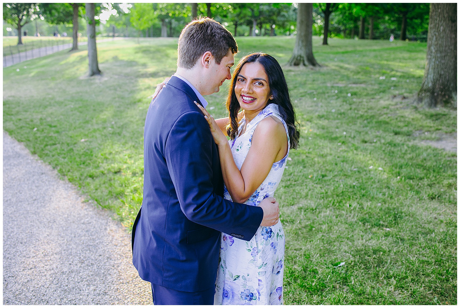 couple cuddling in dc for engagement photos, bride looking at camera