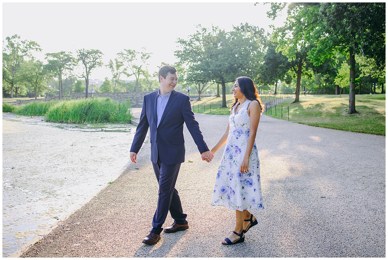 couple walking holding hands in the constitution garden at their Mall Engagement Photos