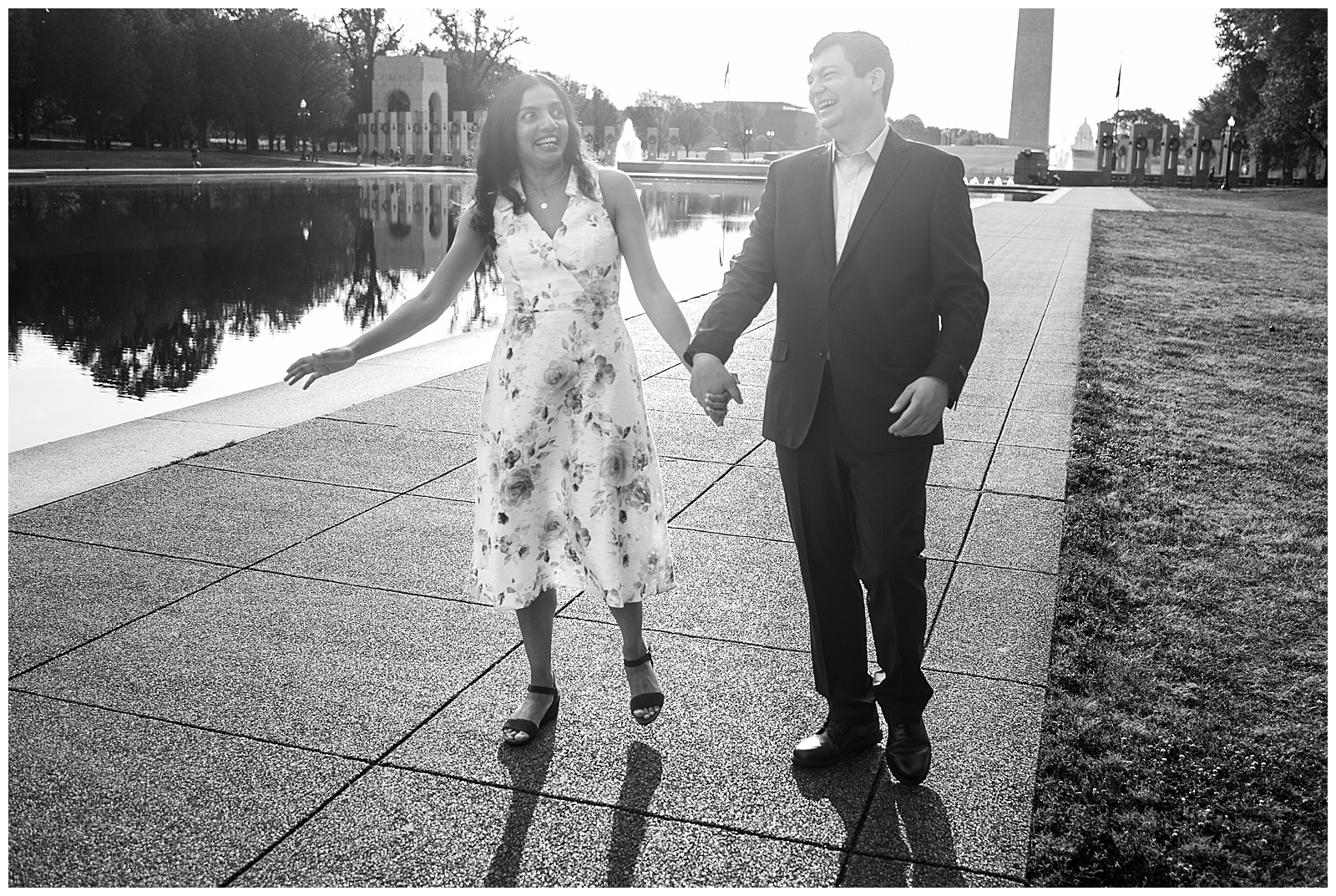 couple laughing in front of the reflecting pool at their National Mall Engagement Photos