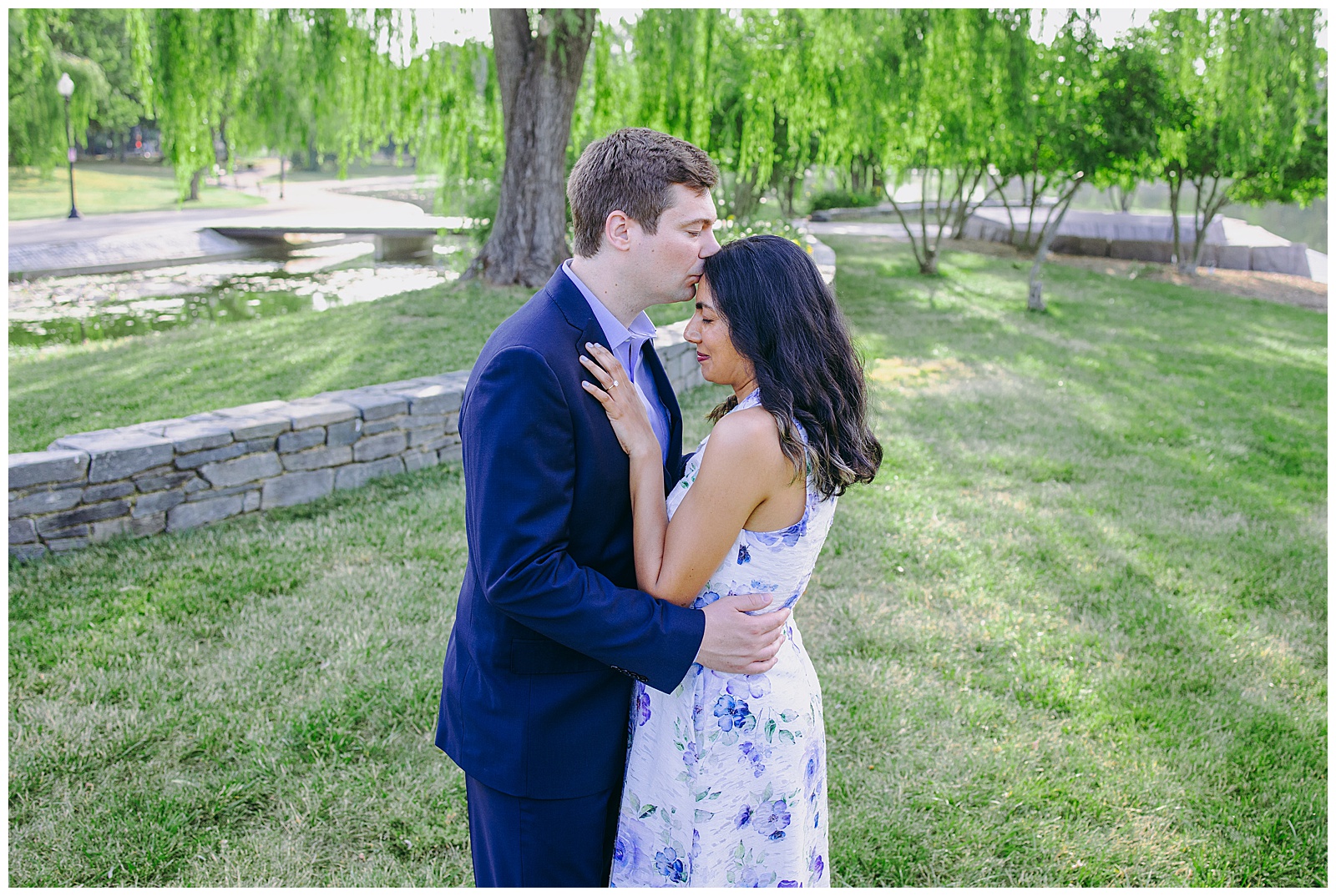 man gives fiancé a kiss on forehead in dc engagement photos