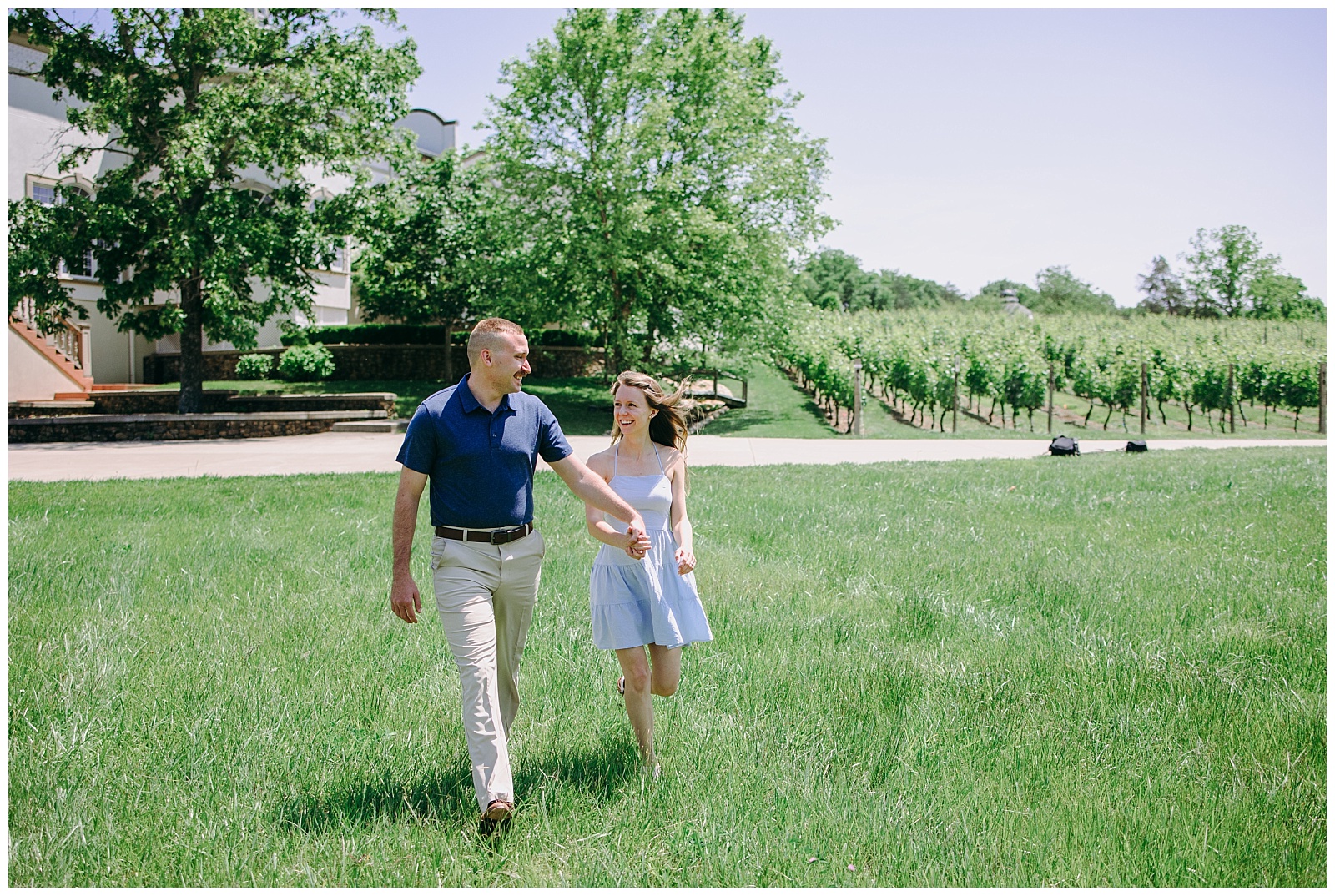 couple walking in grass